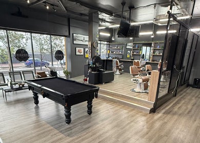 Interior of Lux Barbershop, featuring plush chairs and pool table, Cockburn Central, Western Australia, AU.
