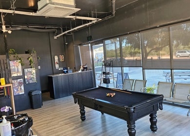 Inviting interior of Lux Barbershop with pool table and modern decor in Cockburn Central, Western Australia, AU.