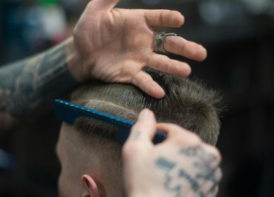 Expert hairstylist crafting a haircut at Lux Barbershop, Cockburn Central, Western Australia, AU.