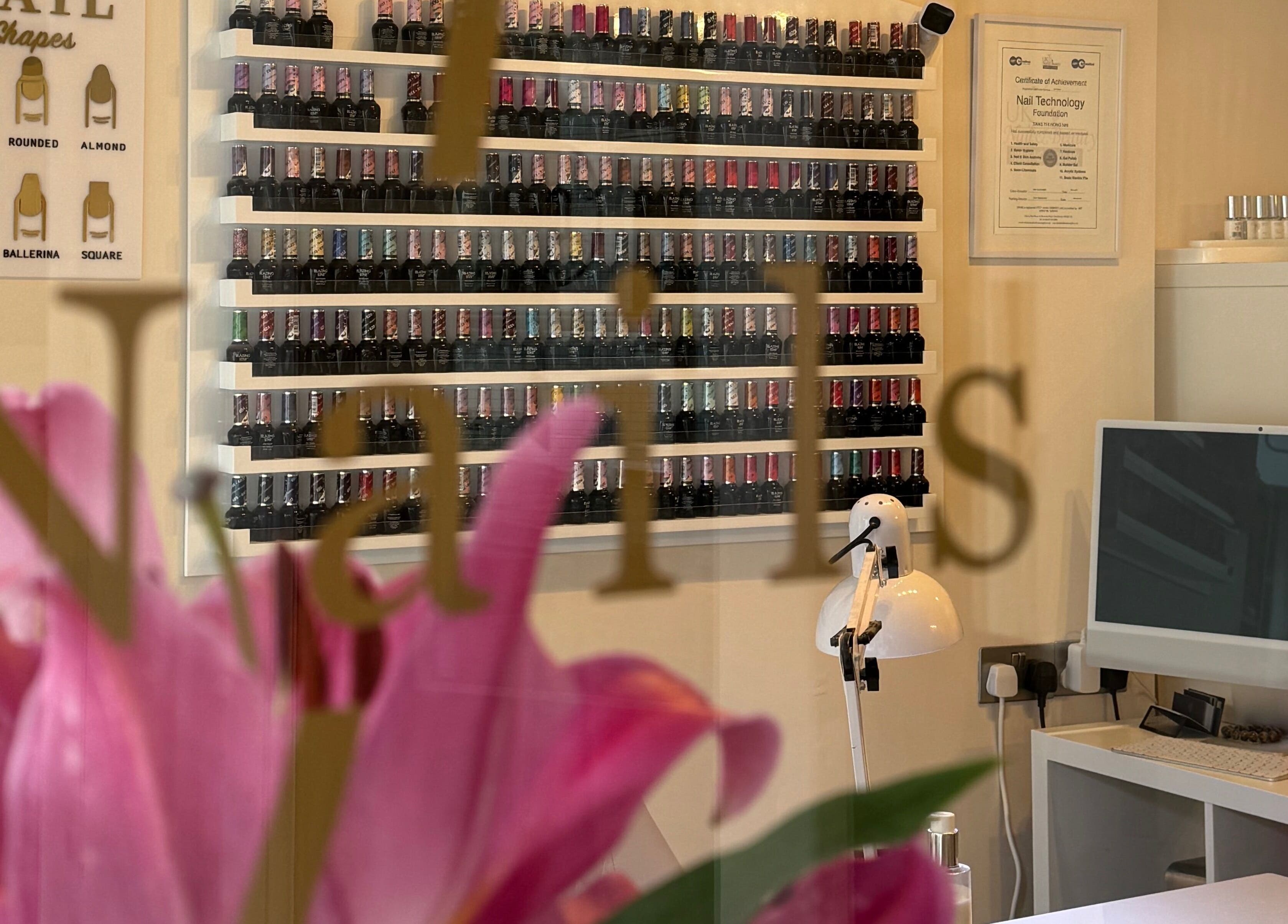 Elegant polish display at Nhi's Nails, Truro, England, GB, highlighting a variety of nail colors.