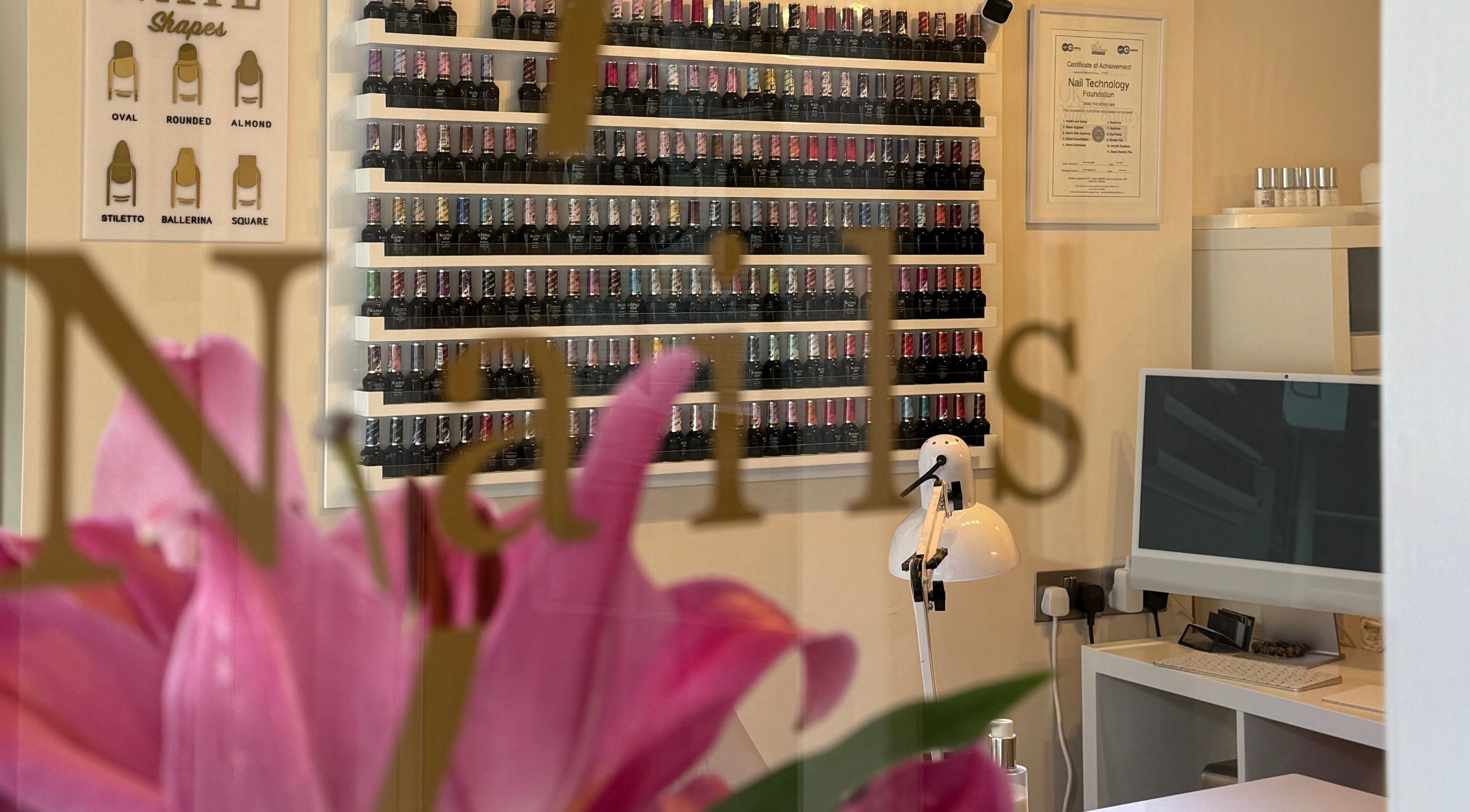 Elegant polish display at Nhi's Nails, Truro, England, GB, highlighting a variety of nail colors.