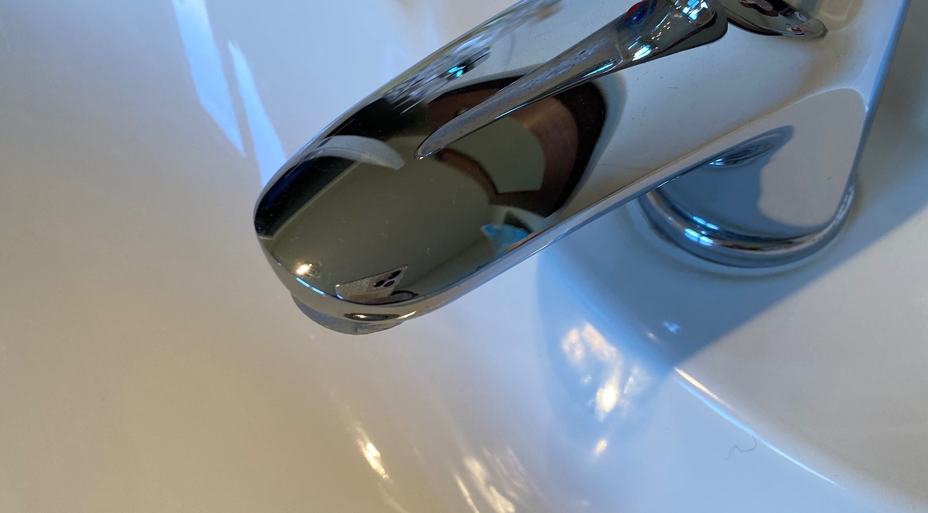 Shiny chrome faucet at Mz Joys Cleaning Service, Mamaku, Bay Of Plenty Region, NZ, showcasing pristine cleaning.