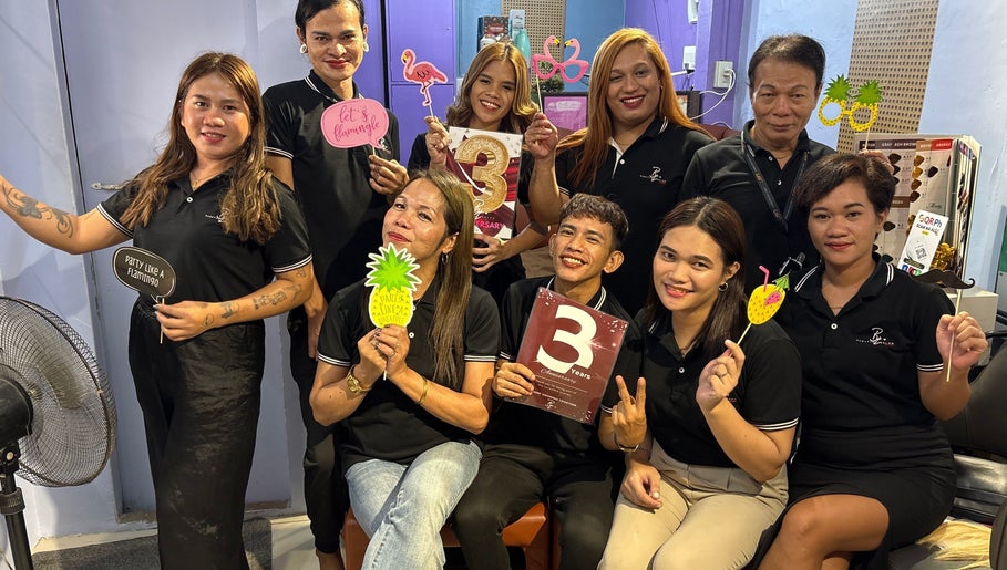 Baratto Salon team celebrating with props in City Of Santa Rosa, Calabarzon, PH.