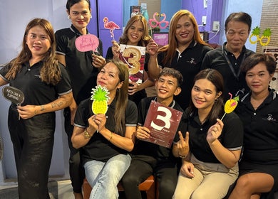 Baratto Salon team celebrating with props in City Of Santa Rosa, Calabarzon, PH.