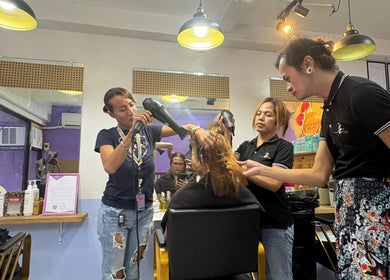 Stylists blow-drying a client's hair at Baratto Salon, City Of Santa Rosa, Calabarzon, PH for a chic finish.