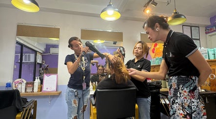 Stylists blow-drying a client's hair at Baratto Salon, City Of Santa Rosa, Calabarzon, PH for a chic finish.