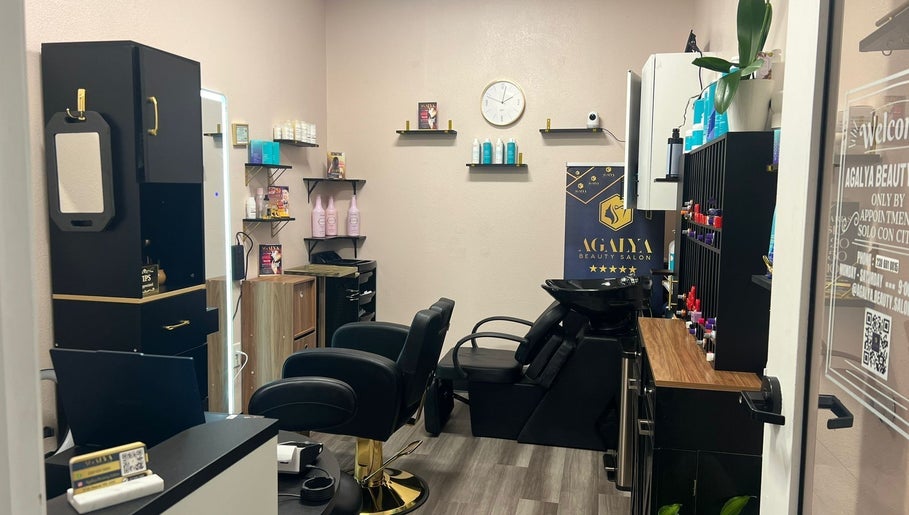 Stylish interior of Agalya Beauty Salon in Charlotte, North Carolina, US featuring chic decor and salon tools.