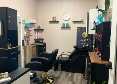 Stylish interior of Agalya Beauty Salon in Charlotte, North Carolina, US featuring chic decor and salon tools.