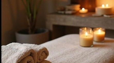 Tranquil spa setting with candles and towels at Body Healing, Glasgow, Scotland, GB.