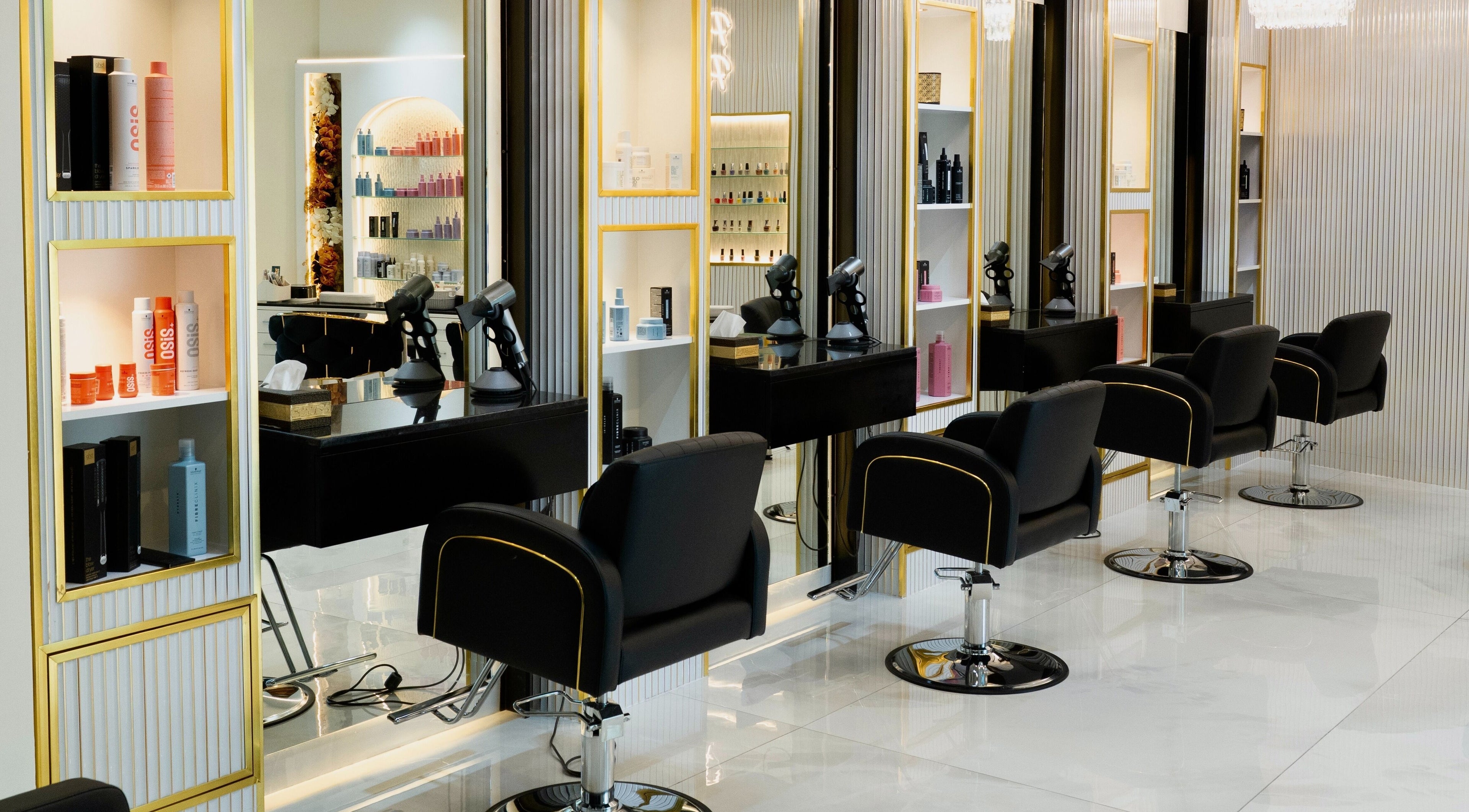 Elegant salon interior at Helin Eren Beauty Hair Spa in Dubai, Dubai, AE with chic black chairs and stylish decor.