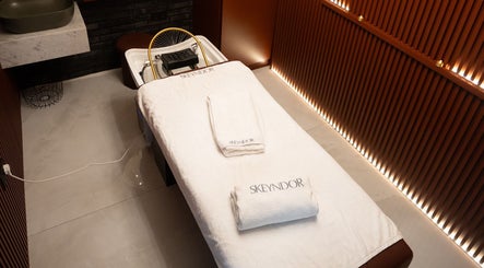 Relaxing treatment room at Helin Eren Beauty Hair Spa, Dubai, Dubai, AE, featuring a spa bed with elegant towels.