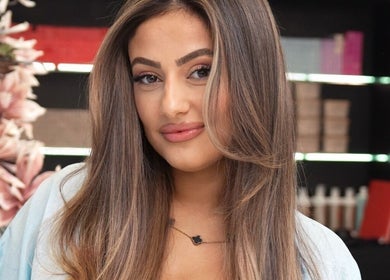 Smiling woman with styled hair at Helin Eren Beauty Hair Spa, Dubai, Dubai, AE.