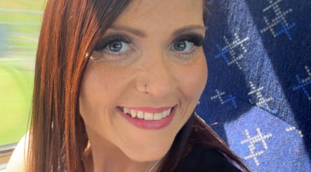 Happy woman enjoying a sunny day, showcasing services at Fabulash by Kimberley in Elgin, Scotland, GB.