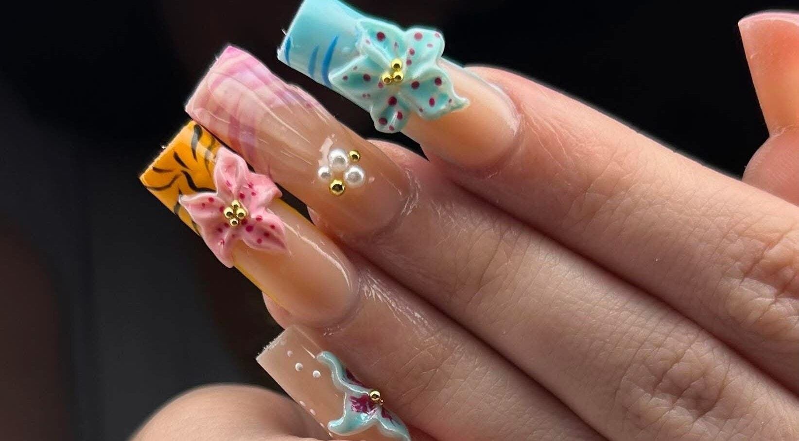 Intricate floral nail design by ABL Nails, Erie, Pennsylvania, US, featuring vibrant 3D flowers.