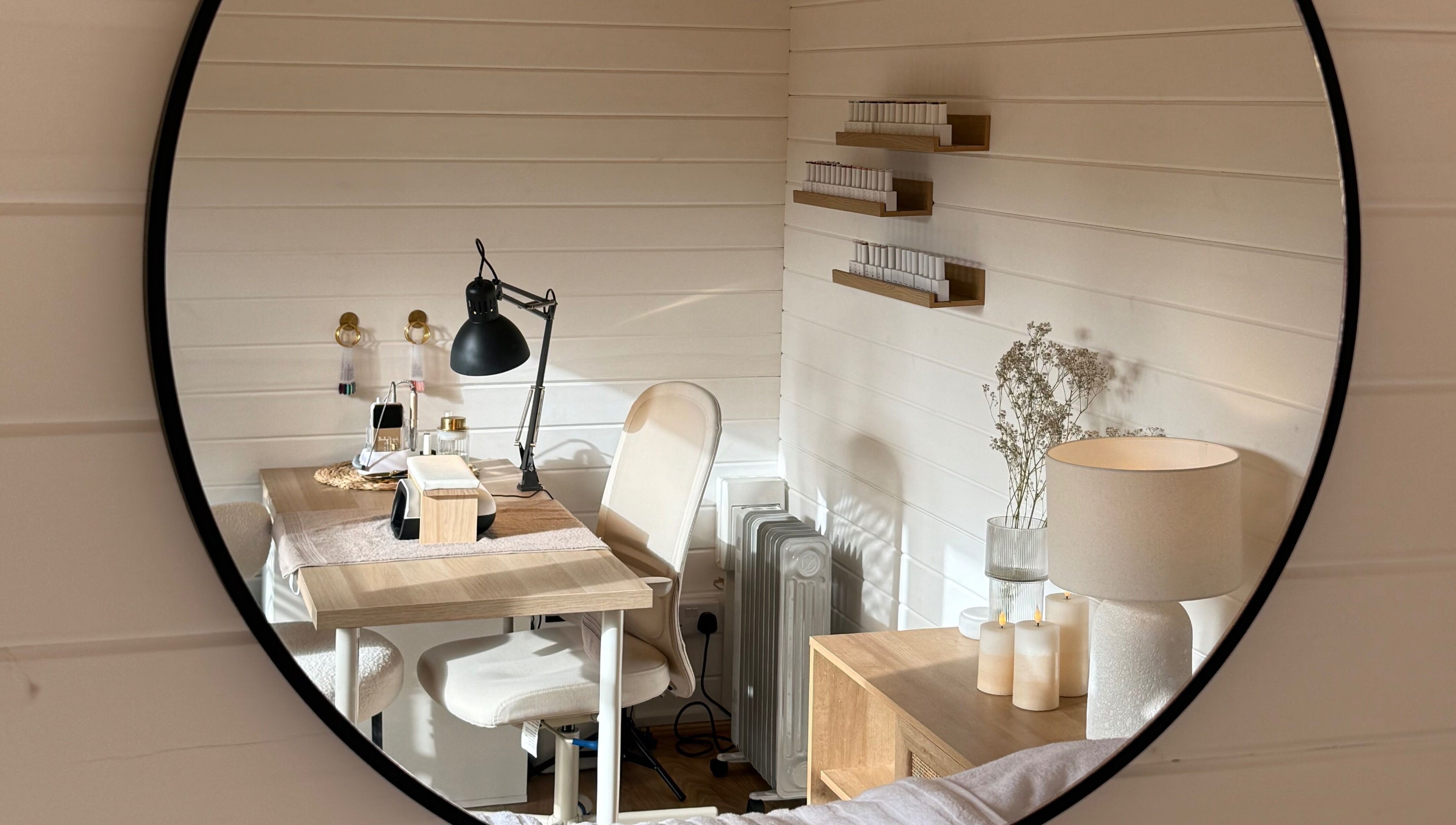 Elegant beauty workspace at The Beauty Studio by Charlotte, Wickham Bishops, England, GB shown in mirror.