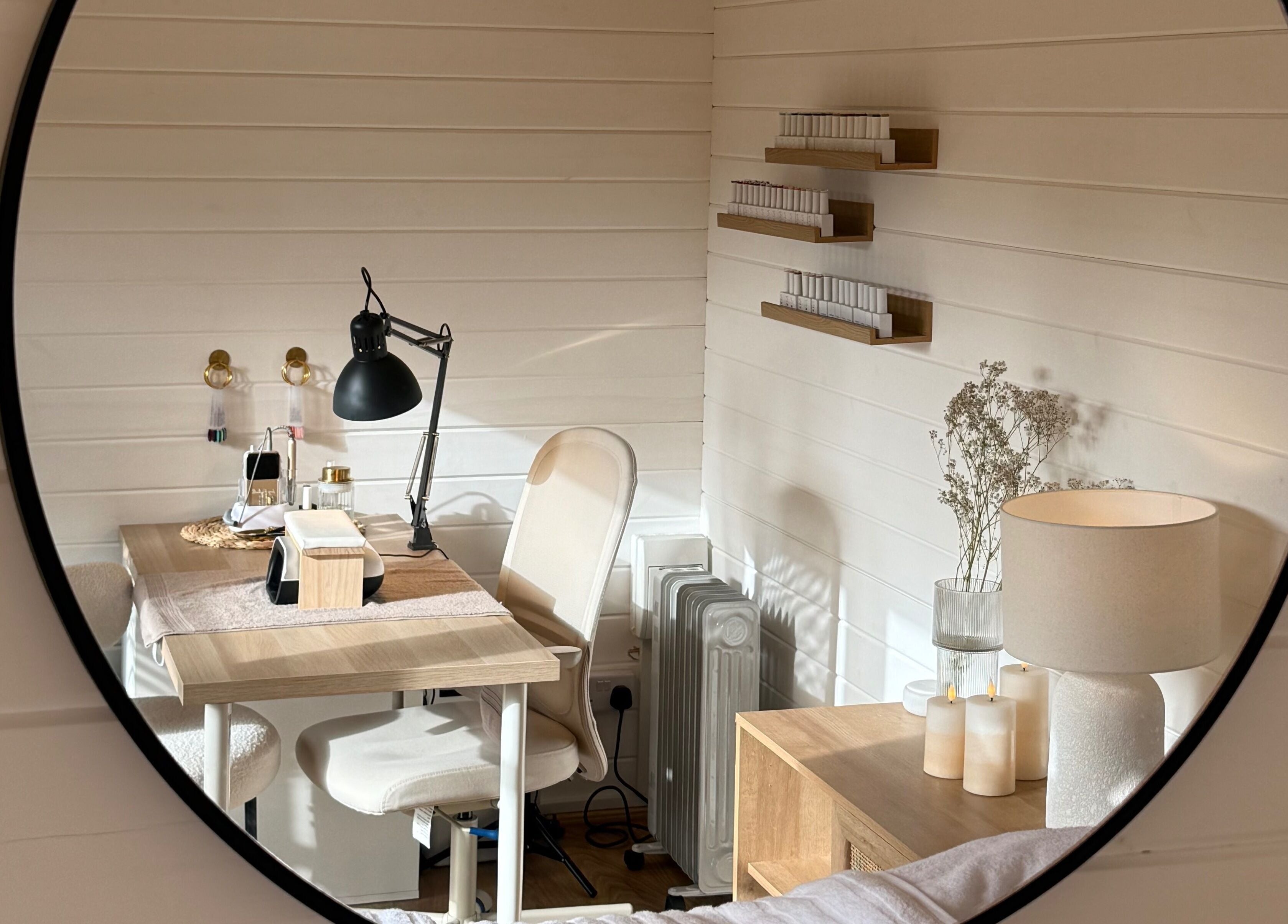 Elegant beauty workspace at The Beauty Studio by Charlotte, Wickham Bishops, England, GB shown in mirror.