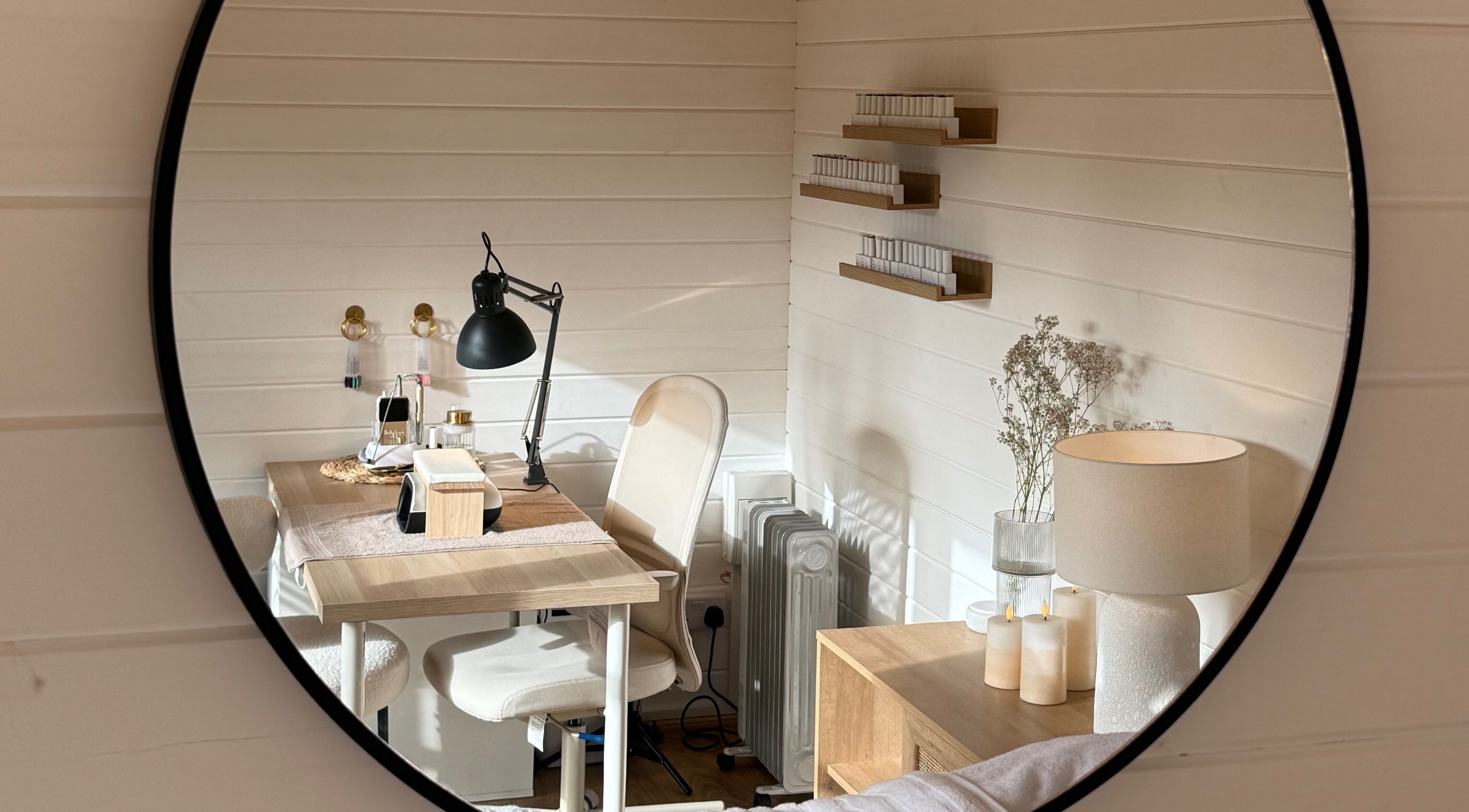 Elegant beauty workspace at The Beauty Studio by Charlotte, Wickham Bishops, England, GB shown in mirror.