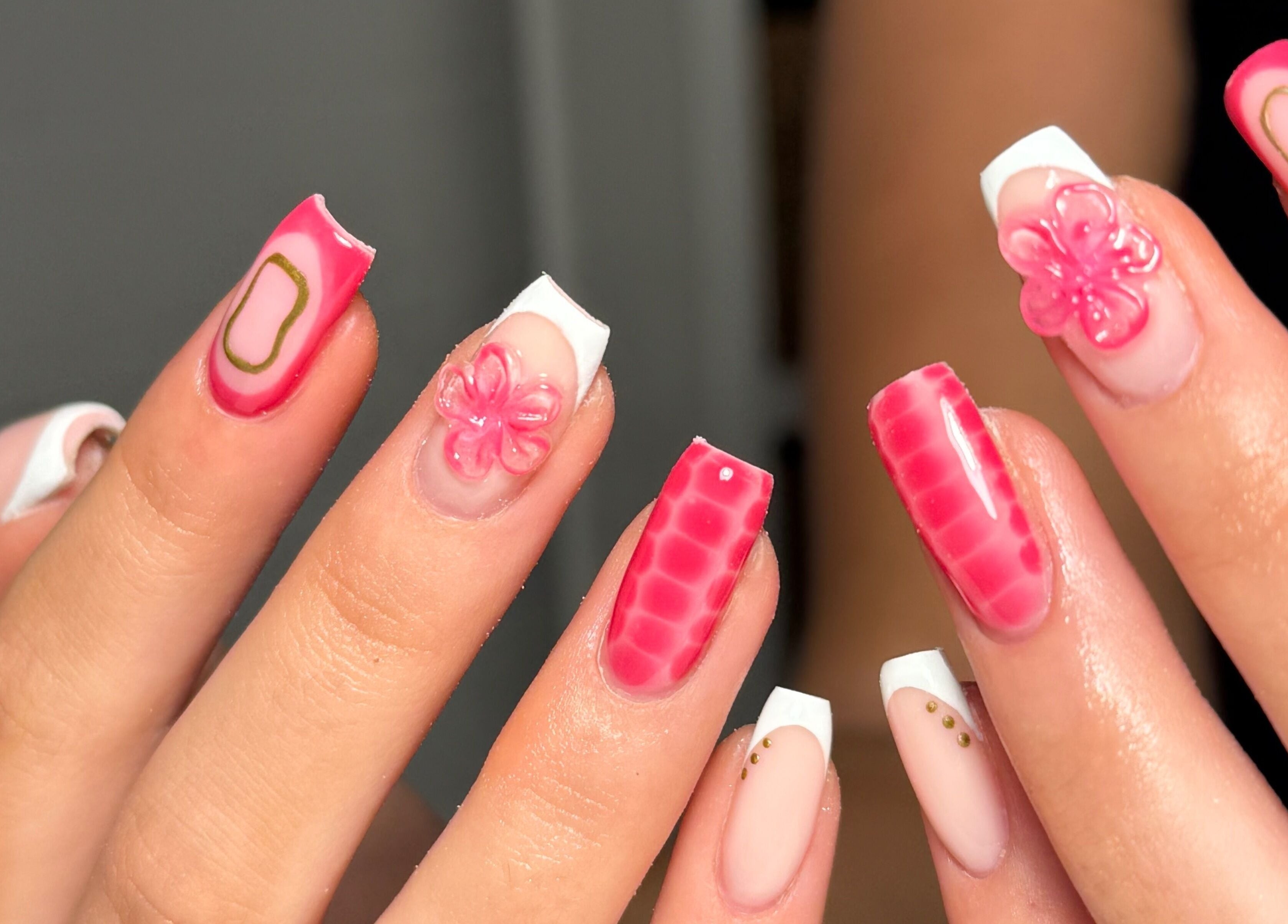 Vibrant pink and white floral nail design at The Beauty Studio by Charlotte, Wickham Bishops, England, GB.