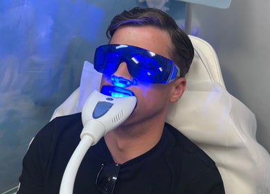 A client receives a blue light facial treatment at The RL Aesthetic in Milton Keynes, England, GB.