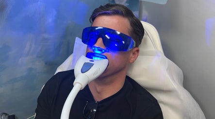 A client receives a blue light facial treatment at The RL Aesthetic in Milton Keynes, England, GB.