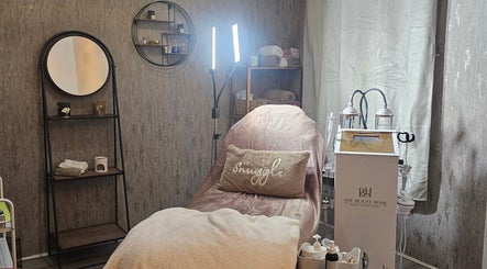 Tranquil spa room at Beauty Home, Edinburgh, Scotland, GB featuring a plush treatment bed and serene decor.