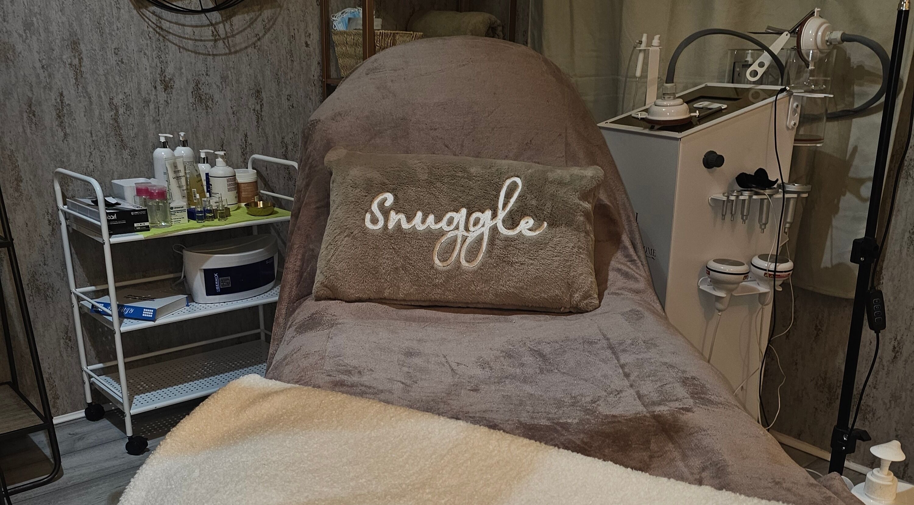 Cozy treatment area at Beauty Home, Edinburgh, Scotland, GB, featuring a plush bed and skincare equipment.