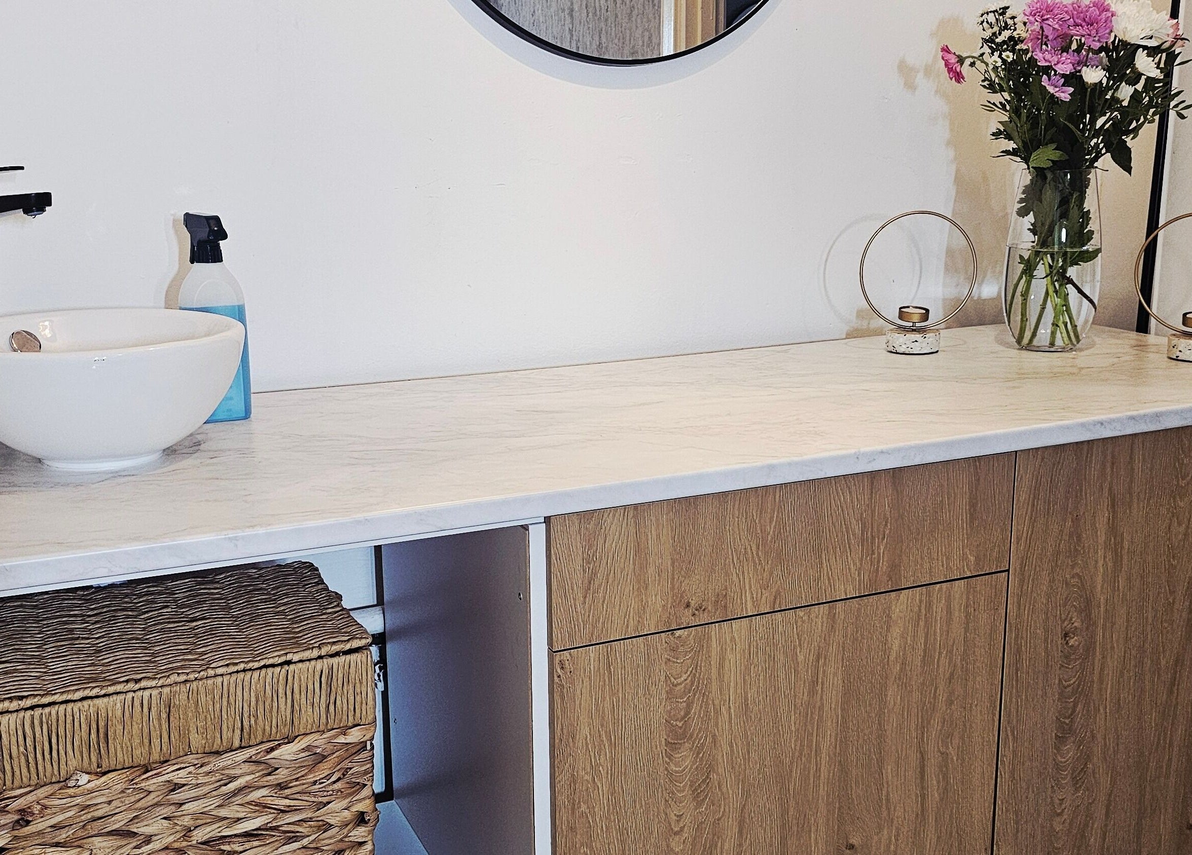 Elegant vanity top at Beauty Home in Edinburgh, Scotland, GB with flowers and candle holders.