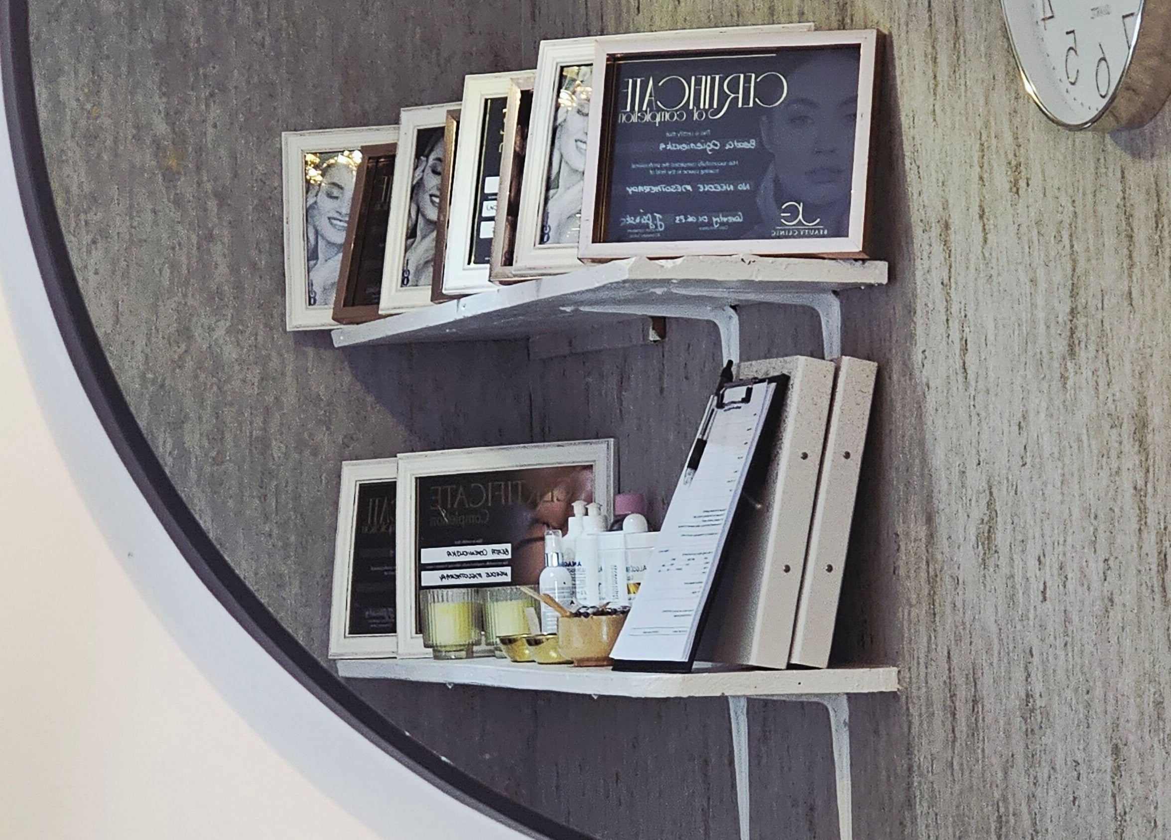 Reflective view of shelves with certificates at Beauty Home, Edinburgh, Scotland, GB.