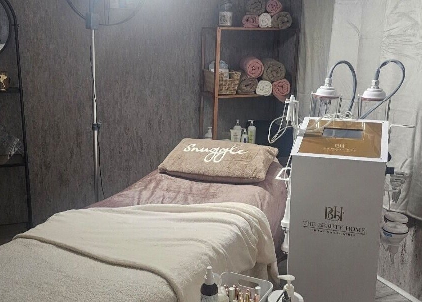 Beauty room at Beauty Home, Edinburgh, Scotland, GB with a treatment bed and equipment.