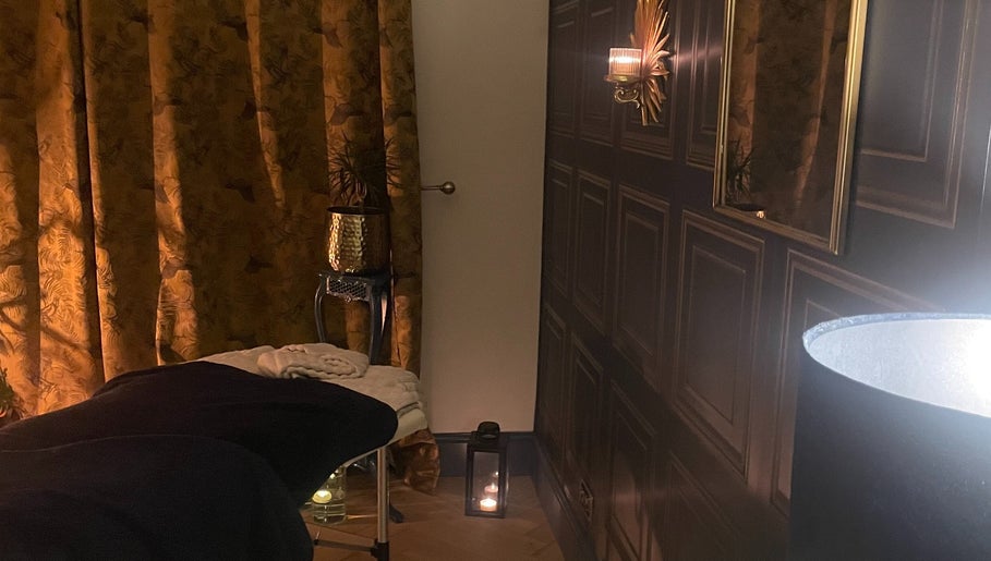 Relaxing spa room in The Wellness Room by Sarah-Jane in Colchester, England, GB with a treatment bed and warm lighting.