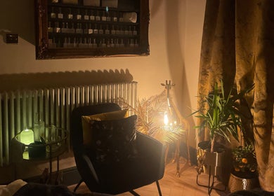Ambient corner at The Wellness Room by Sarah-Jane, Colchester, England, GB, featuring warm lighting and plants.