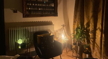Ambient corner at The Wellness Room by Sarah-Jane, Colchester, England, GB, featuring warm lighting and plants.