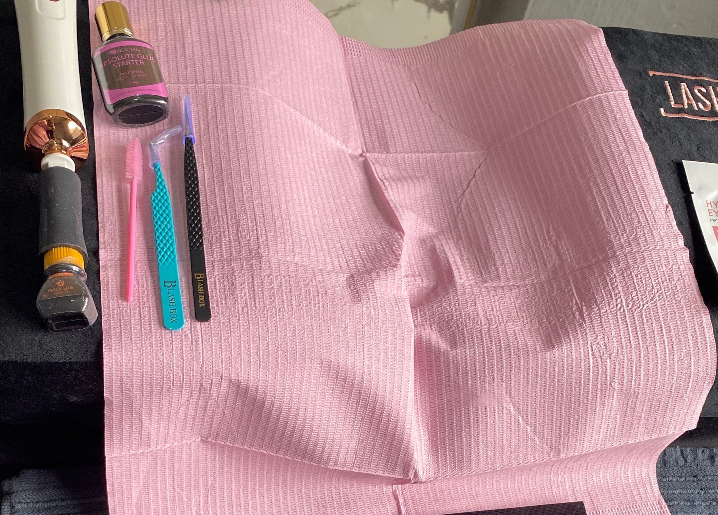 Lash N Wax beauty tools on display in Sandton, Gauteng, ZA, including tweezers and pink accessories.