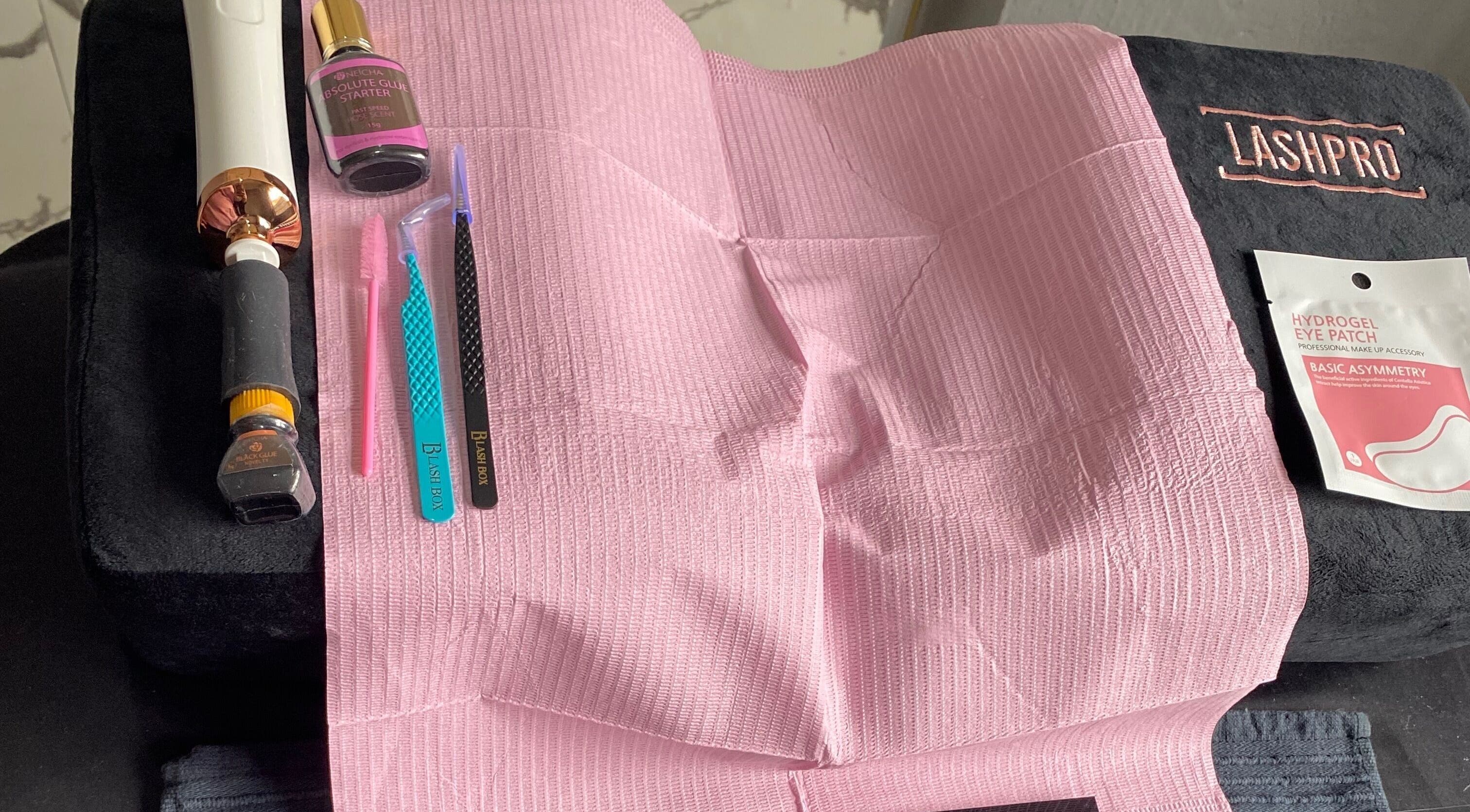 Lash N Wax beauty tools on display in Sandton, Gauteng, ZA, including tweezers and pink accessories.