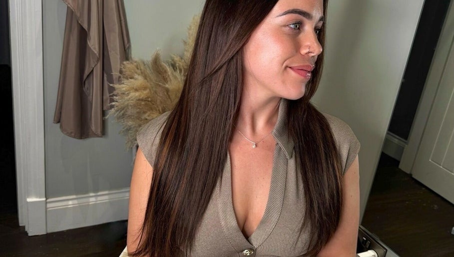 Woman with sleek hair at The Tape Studio in Huddersfield, England, GB, showcasing a trendy beauty look.