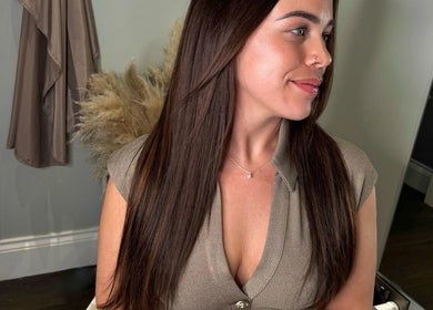 Woman with sleek hair at The Tape Studio in Huddersfield, England, GB, showcasing a trendy beauty look.