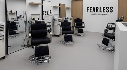 Interior of Fearless Image & Grooming in Singapore, Singapore, SG showcasing modern black chairs and mirrors.