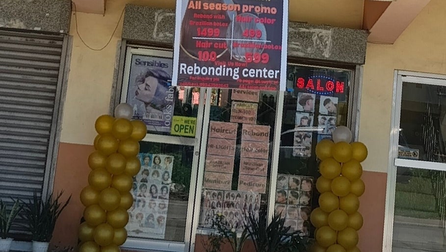 Front entrance of Touch of a&j salon in Cabuyao City, Calabarzon, PH with promotional signs and golden balloons.