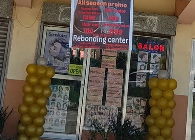 Front entrance of Touch of a&j salon in Cabuyao City, Calabarzon, PH with promotional signs and golden balloons.