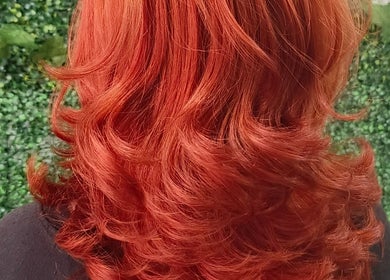 Vibrant red hair styled in waves at Touch of a&j salon, Cabuyao City, Calabarzon, PH.