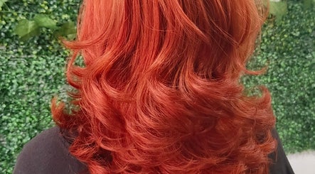 Vibrant red hair styled in waves at Touch of a&j salon, Cabuyao City, Calabarzon, PH.