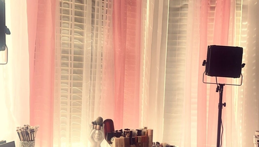 Makeup brushes and products at Beauty By M in Northampton, England, GB. Pink curtains and lighting setup.