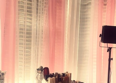 Makeup brushes and products at Beauty By M in Northampton, England, GB. Pink curtains and lighting setup.