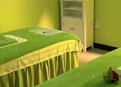 Relaxing massage tables at Footy Rooty Massage Huntsville AL, Huntsville, Alabama, US in a soothing green room.
