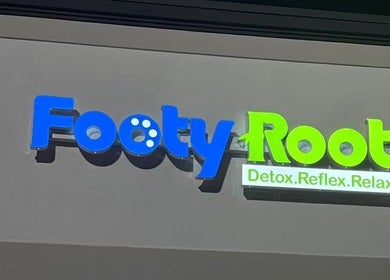 Footy Rooty Massage Huntsville AL sign in Huntsville, Alabama, US showcasing its vibrant colors.