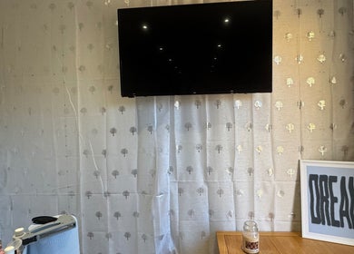 Cozy room interior with TV and decor at SWbeautyx, Dunmow, England, GB.