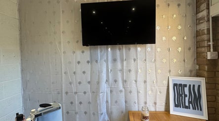 Cozy room interior with TV and decor at SWbeautyx, Dunmow, England, GB.