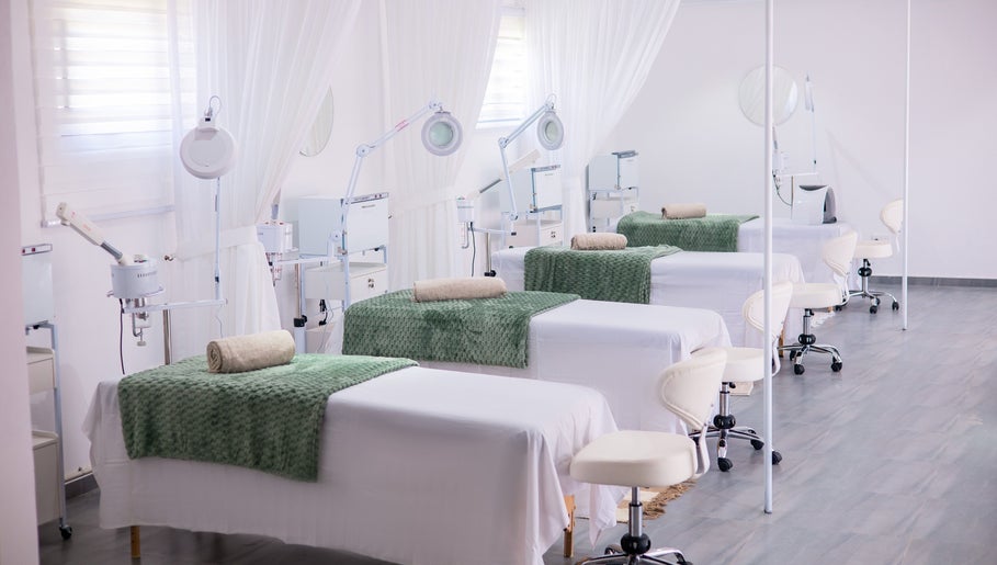 Luxurious facial treatment beds at Micata Facial Bar, Lusaka, Lusaka Province, ZM, with green accents.