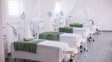 Luxurious facial treatment beds at Micata Facial Bar, Lusaka, Lusaka Province, ZM, with green accents.