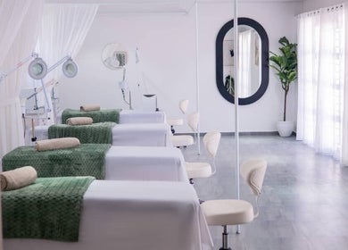 Relaxing treatment room at Micata Facial Bar, Lusaka, Lusaka Province, ZM with spa beds and soft lighting.